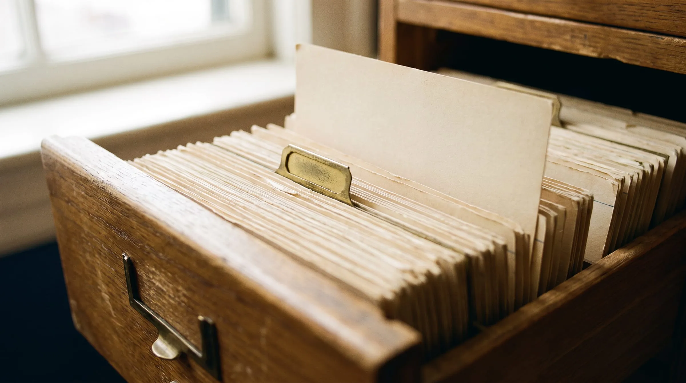 An open card catalogue drawer, every card in its place.